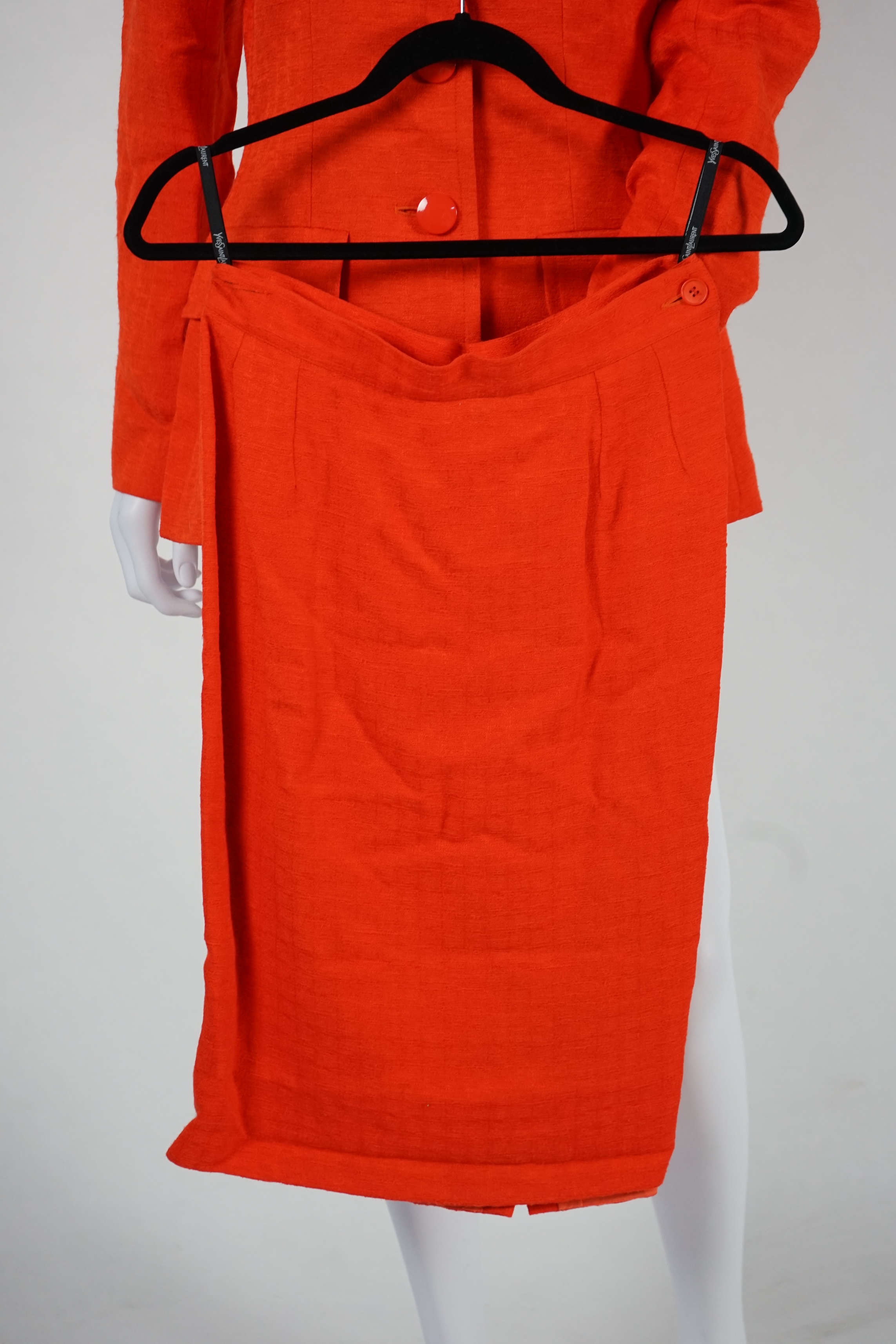 Two vintage Yves Saint Laurent variation lady's skirt suits, royal blue and orange. F 40 (UK 12).Please note alterations to make the waist smaller may have been carried out on some of the skirts. Proceeds to Happy Paws P